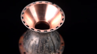 A small-scale model of the space shuttle nozzle.